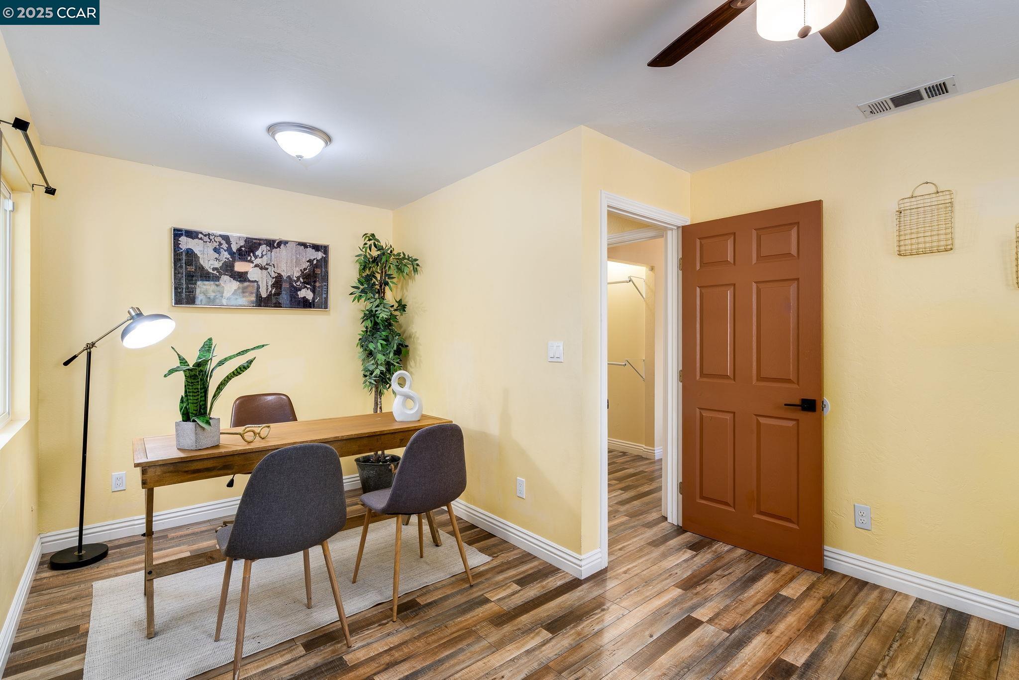 2941 Crawford Street Concord, CA 94518 - Photo 17 of 27 a view of a workspace with furniture and wooden floor