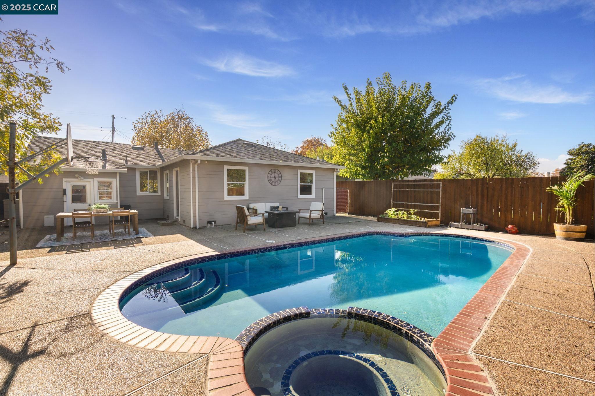 2941 Crawford Street Concord, CA 94518 - Photo 21 of 27 a swimming pool with outdoor seating and yard