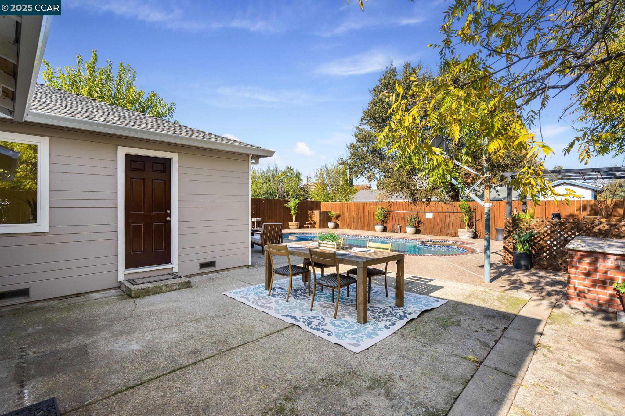 2941 Crawford Street Concord, CA 94518 - Photo 24 of 27 a view of a patio with table and chairs and potted plants