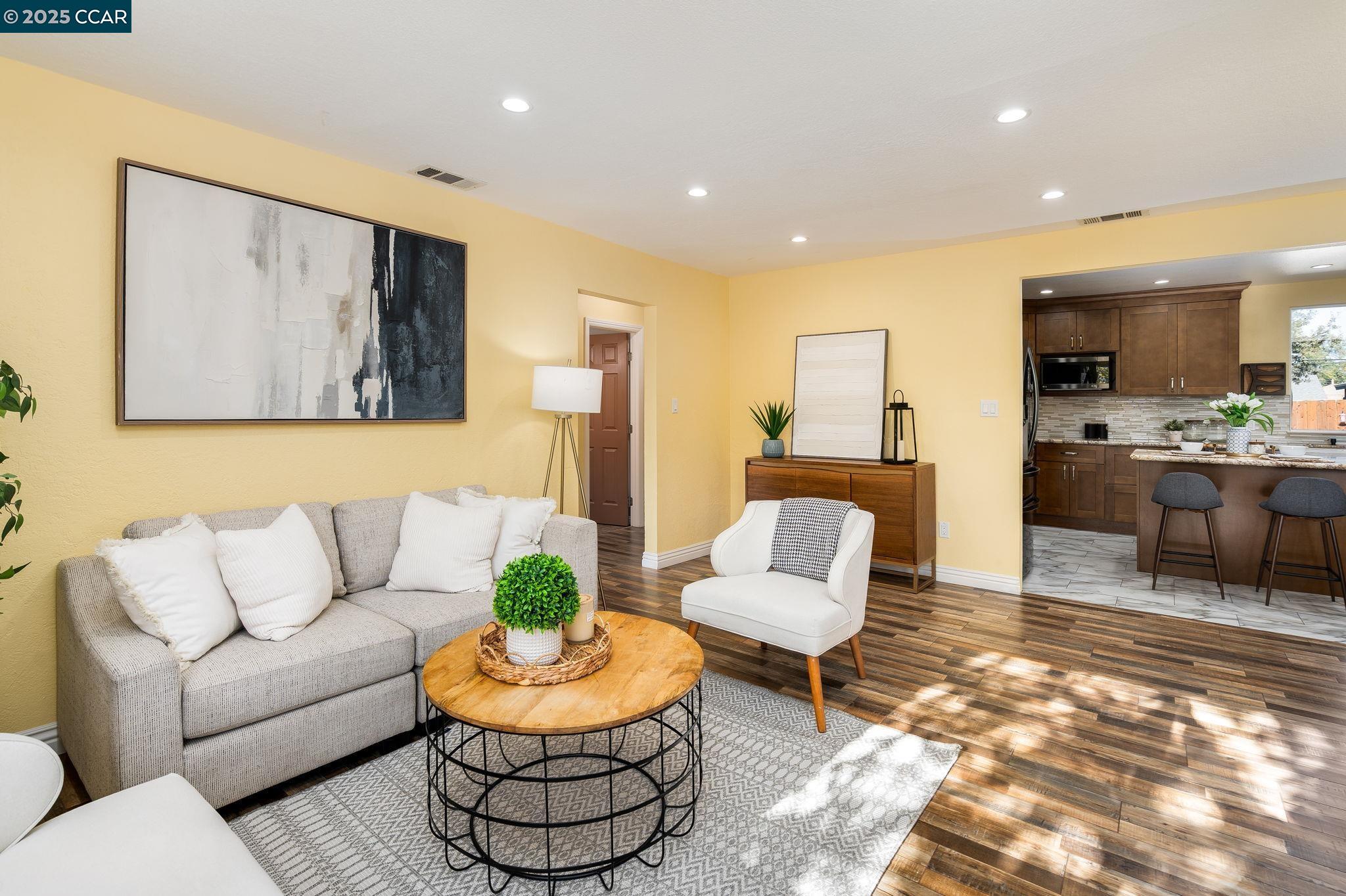 2941 Crawford Street Concord, CA 94518 - Photo 3 of 27 a living room with furniture and a view of kitchen