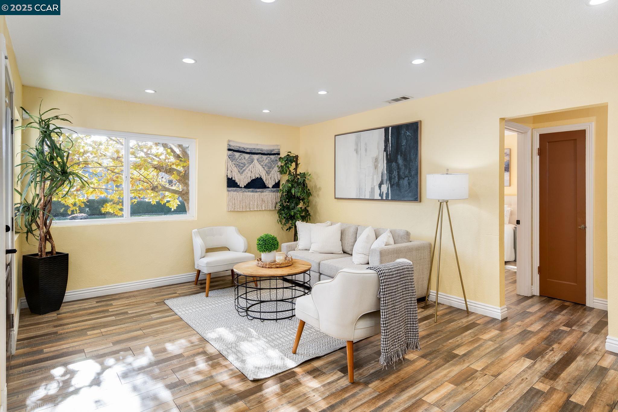 2941 Crawford Street Concord, CA 94518 - Photo 5 of 27 a living room with furniture and a wooden floor