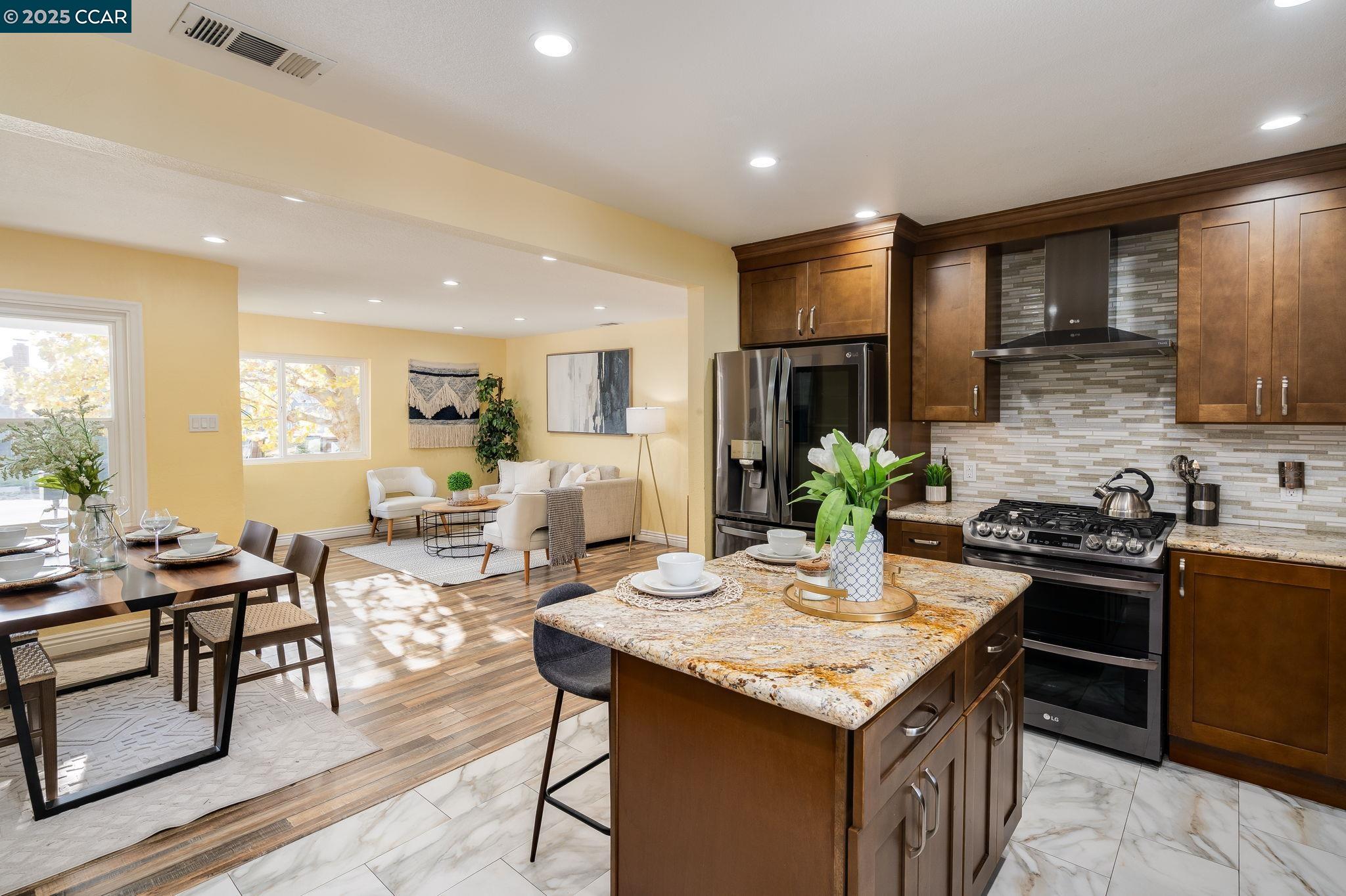 2941 Crawford Street Concord, CA 94518 - Photo 8 of 27 a kitchen that has a table and chairs in it