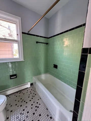a bathroom with a shower and a toilet