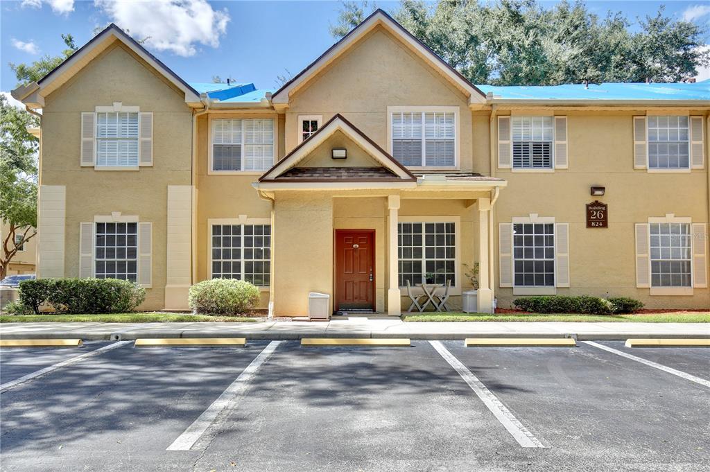 824 Grand Regency Pointe, Unit 100 Altamonte Springs, FL 32714 - Photo 1 of 1 a front view of a house with a yard