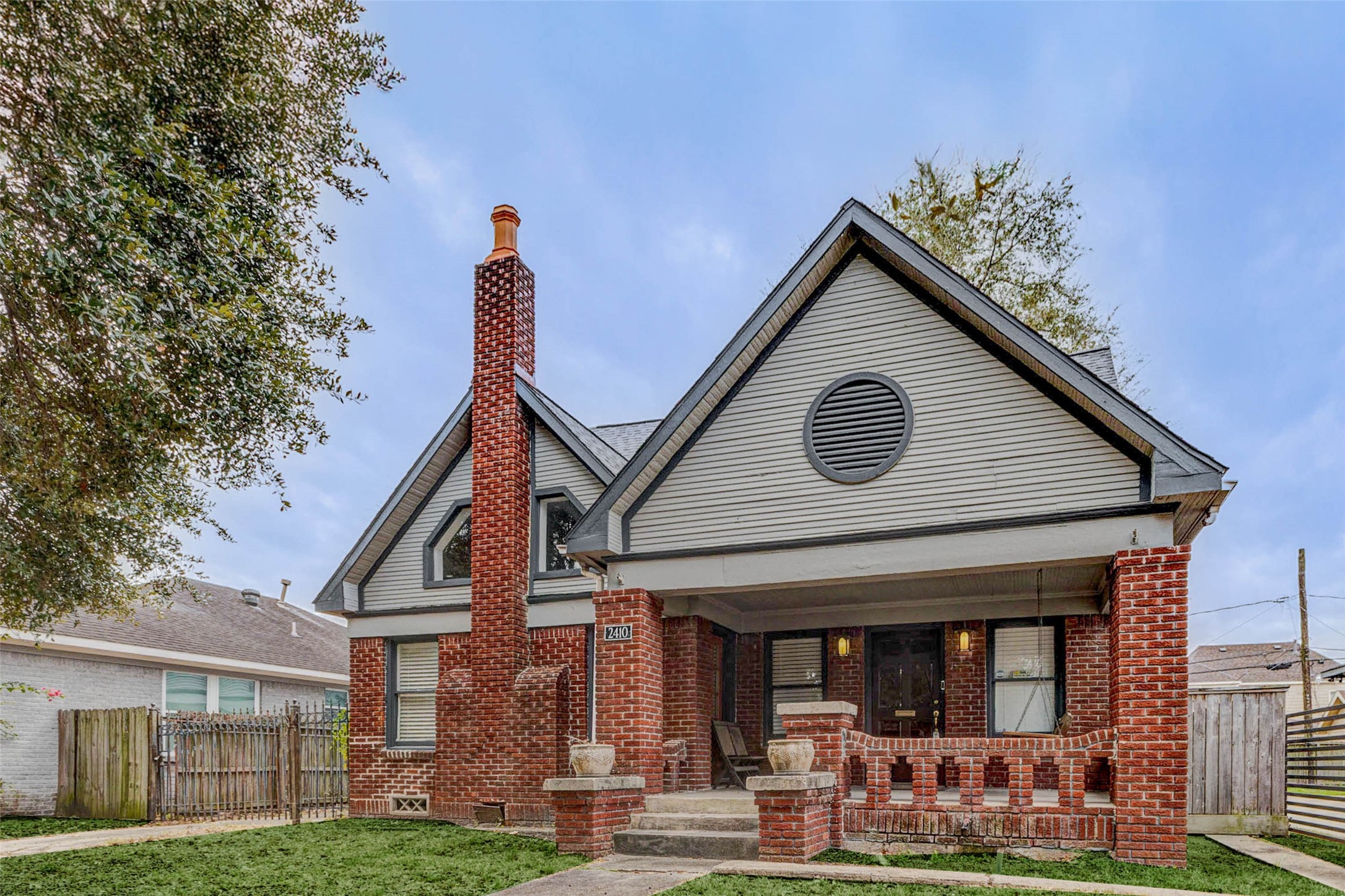 2410 Cleburne Street Houston, TX 77004 - Photo 1 of 27 a front view of a house with garden
