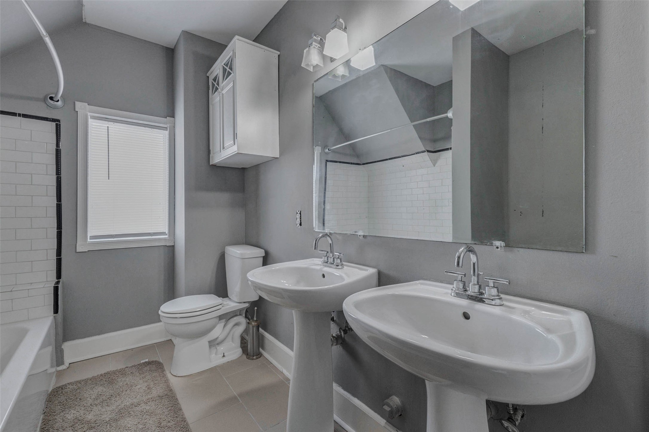 2410 Cleburne Street Houston, TX 77004 - Photo 16 of 27 a bathroom with a sink a toilet and a mirror