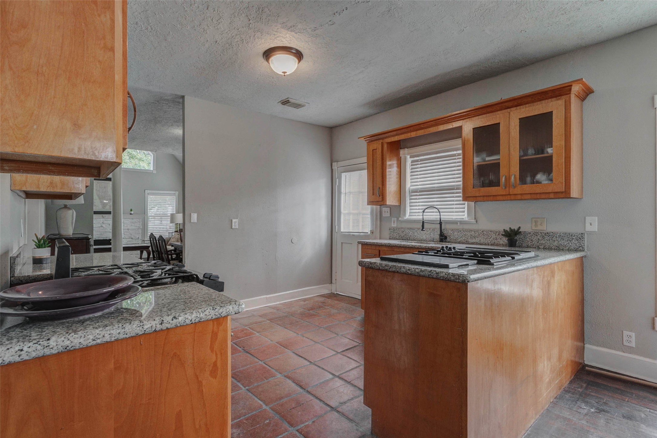 2410 Cleburne Street Houston, TX 77004 - Photo 18 of 27 a kitchen with stainless steel appliances granite countertop a stove and a sink