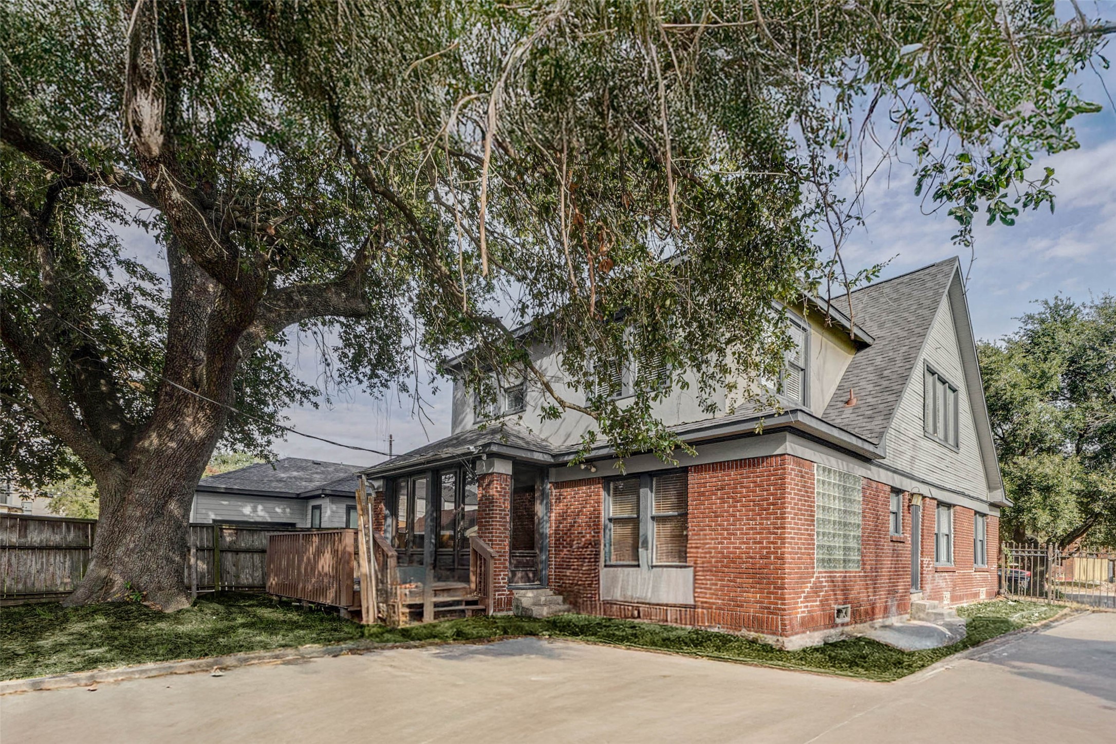2410 Cleburne Street Houston, TX 77004 - Photo 4 of 27 a front view of a house with a tree