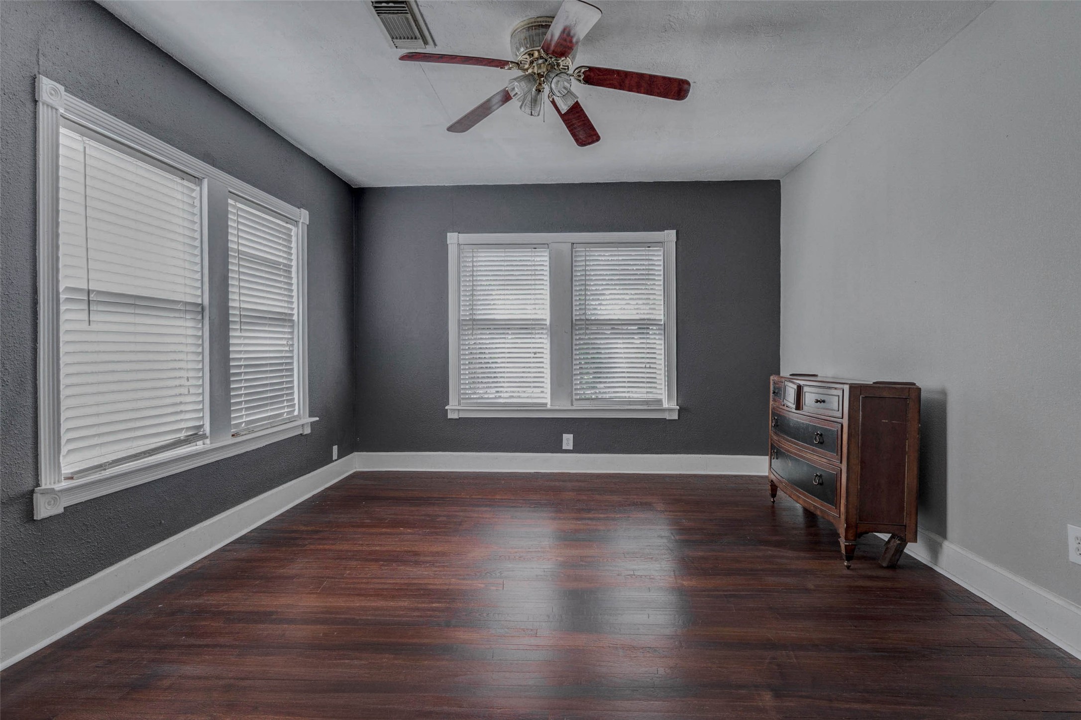 2410 Cleburne Street Houston, TX 77004 - Photo 7 of 27 a view of an empty room with wooden floor and a window