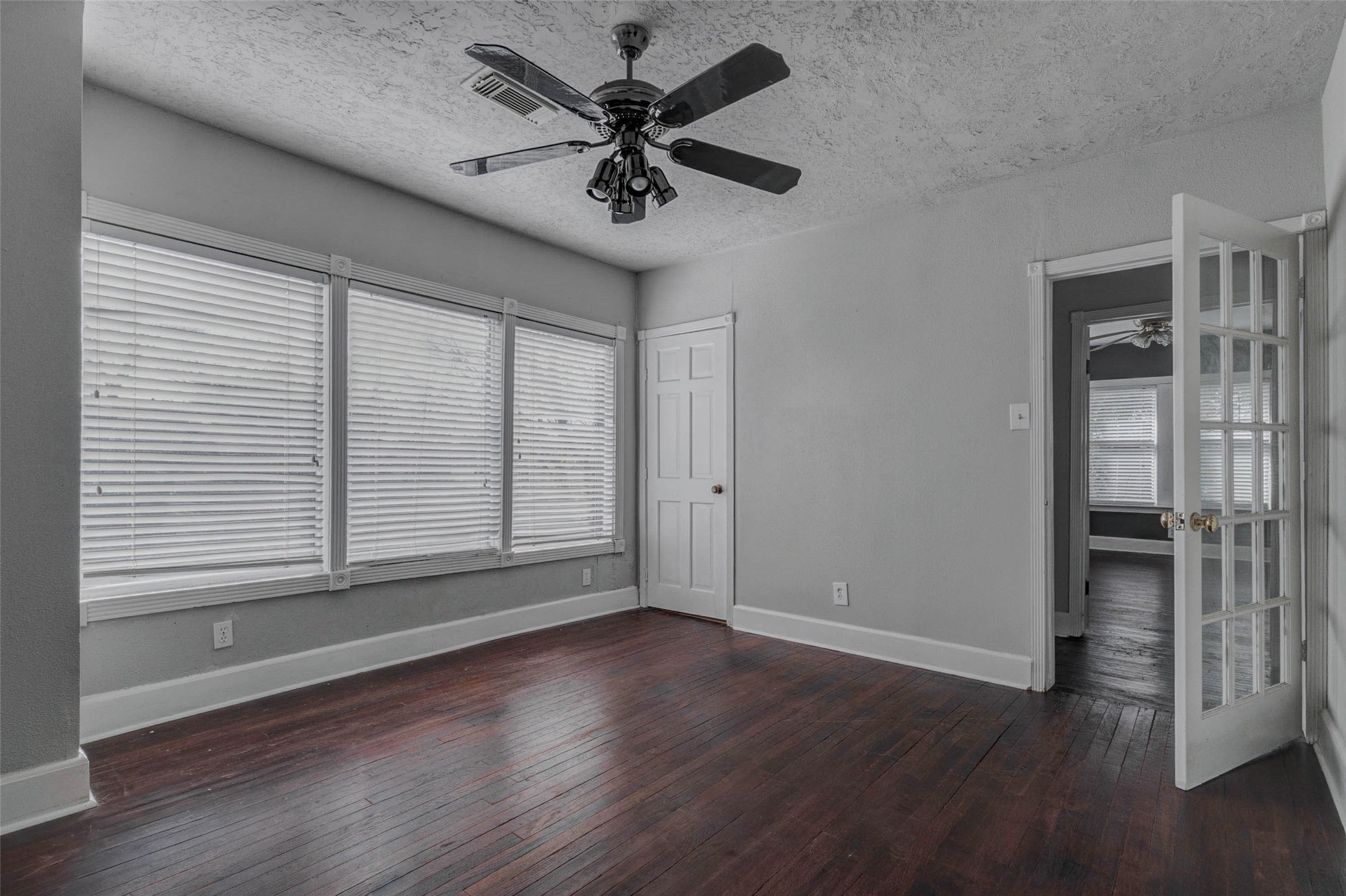 2410 Cleburne Street Houston, TX 77004 - Photo 8 of 27 an empty room with wooden floor and windows