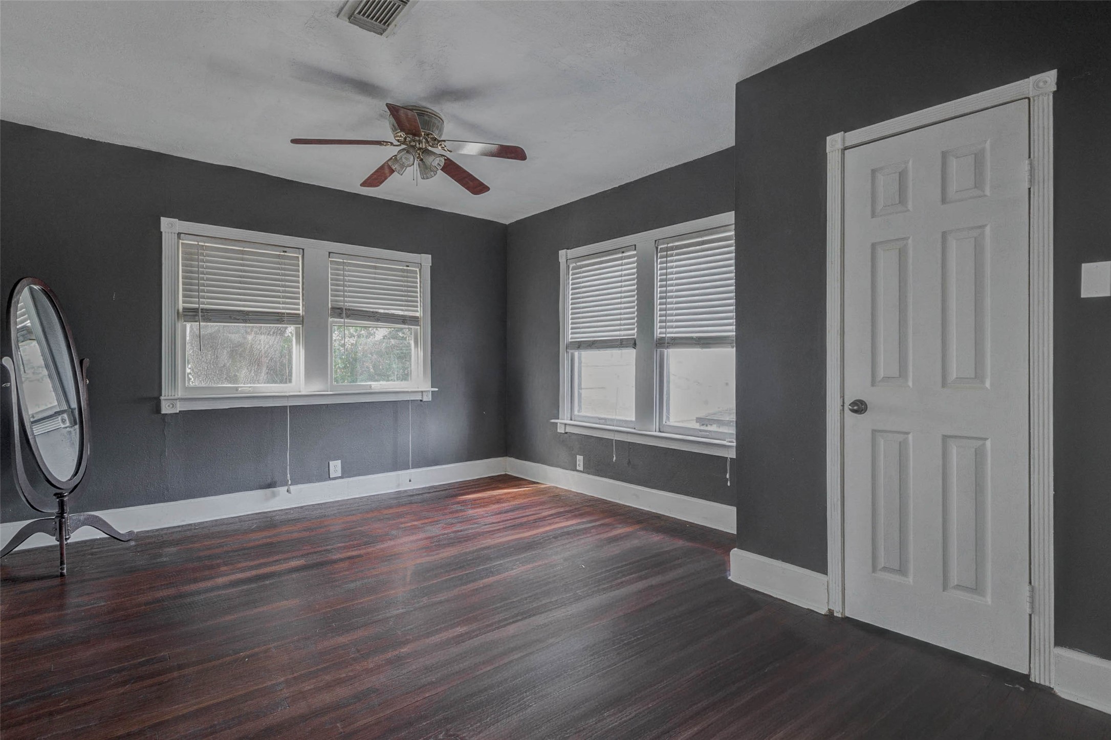 2410 Cleburne Street Houston, TX 77004 - Photo 10 of 27 an empty room with wooden floor fan and windows