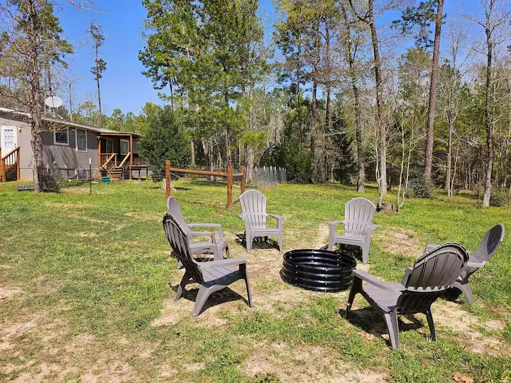 105 Saddle Surrey Road Coldspring, TX 77331 - Photo 10 of 48 a view of a chairs in backyard of house