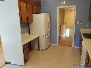 a white refrigerator freezer sitting in a kitchen