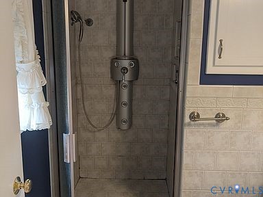 1007 Ethelwood Road Glen Allen, VA 23059 - Photo 15 of 21 a bathroom with a glass shower door