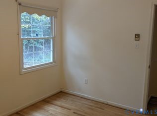1007 Ethelwood Road Glen Allen, VA 23059 - Photo 16 of 21 an empty room with wooden floor and windows
