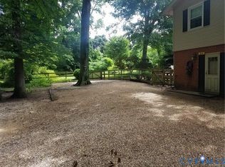 1007 Ethelwood Road Glen Allen, VA 23059 - Photo 20 of 21 a view of a backyard with trees