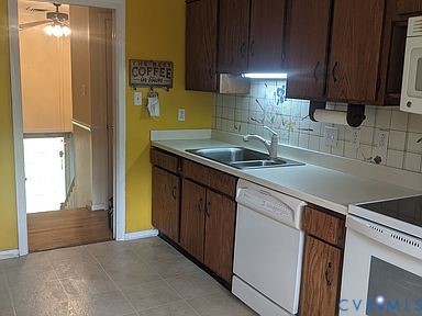 1007 Ethelwood Road Glen Allen, VA 23059 - Photo 10 of 21 a kitchen with stainless steel appliances granite countertop a sink stove and refrigerator