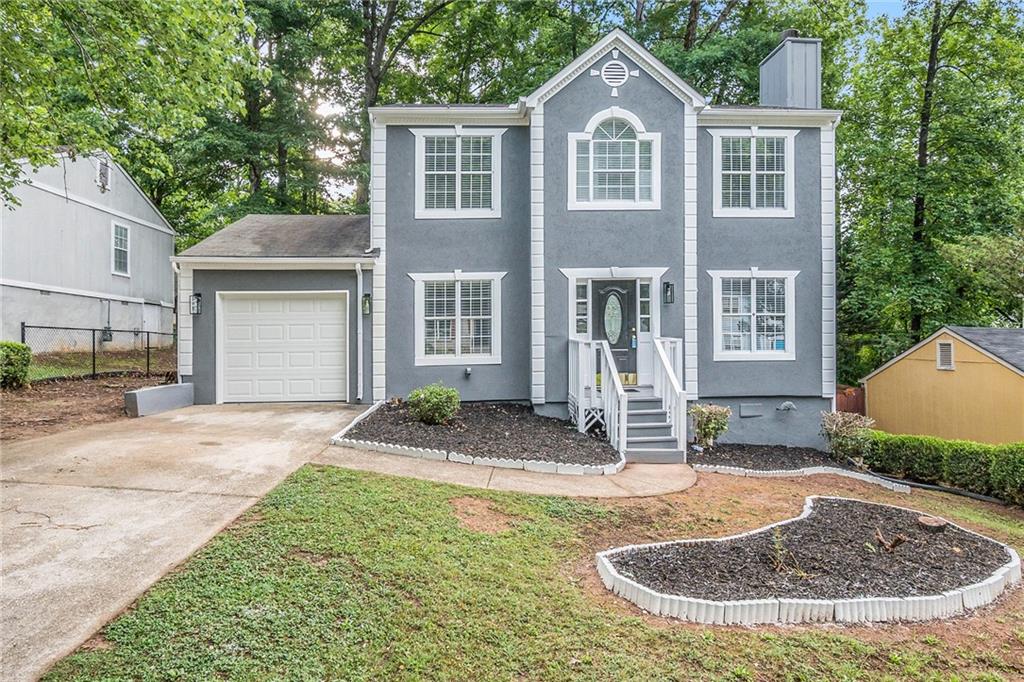 a front view of a house with porch