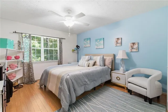 a bedroom with a bed and a couch