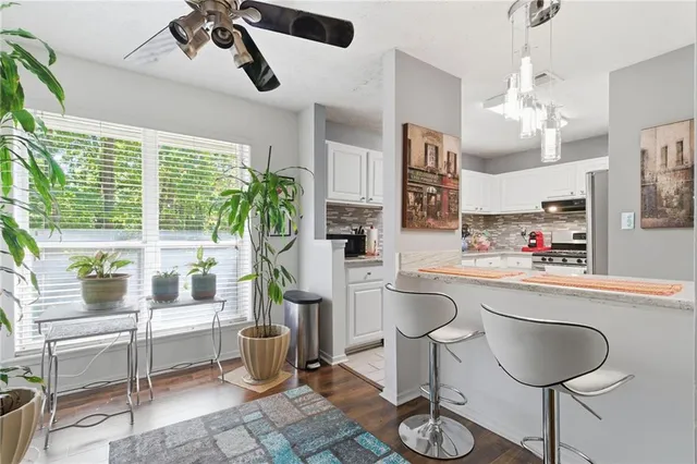 a kitchen with furniture and window