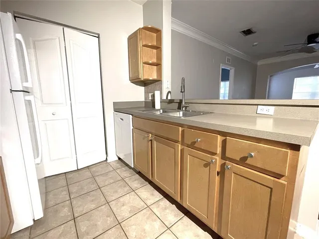 a spacious bathroom with a shower a sink and a mirror