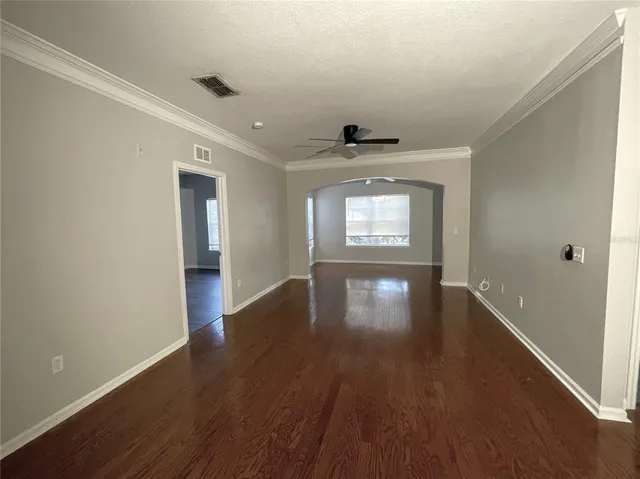 a view of a livingroom with wooden floor