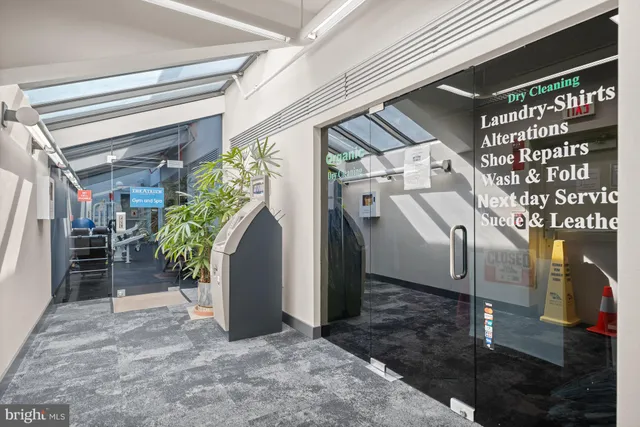 a view of a house with potted plants