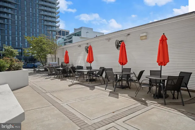 a group of people sitting outside of a building