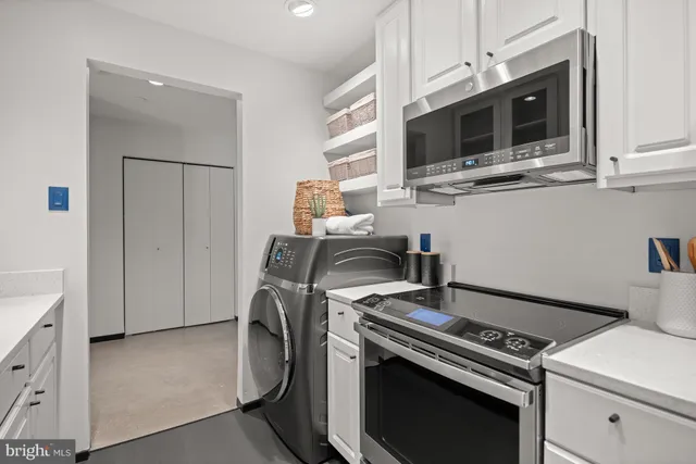 a kitchen with a stove and a microwave