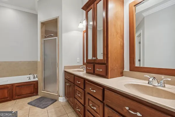a bathroom with a double vanity sink and a mirror