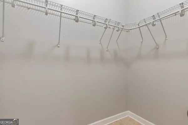a bathroom with a shower and a shower head