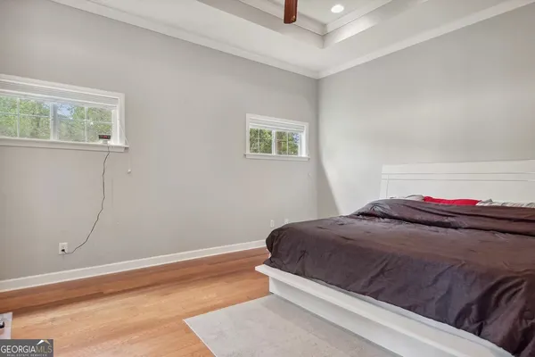 a bedroom with a bed and window