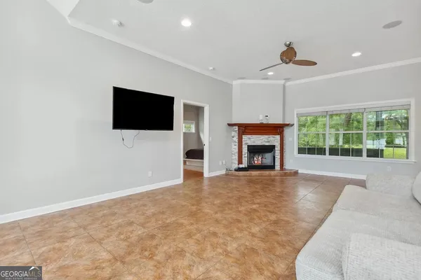 a living room with furniture and a flat screen tv