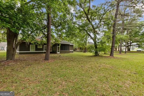 a backyard of a house with lots of green space