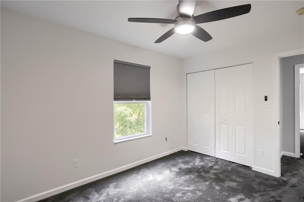1075 Rural Ridge Drive Cheswick, PA 15024 - Photo 19 of 25 Another guest bedroom boasts new carpet, ceiling fan and a large closet.