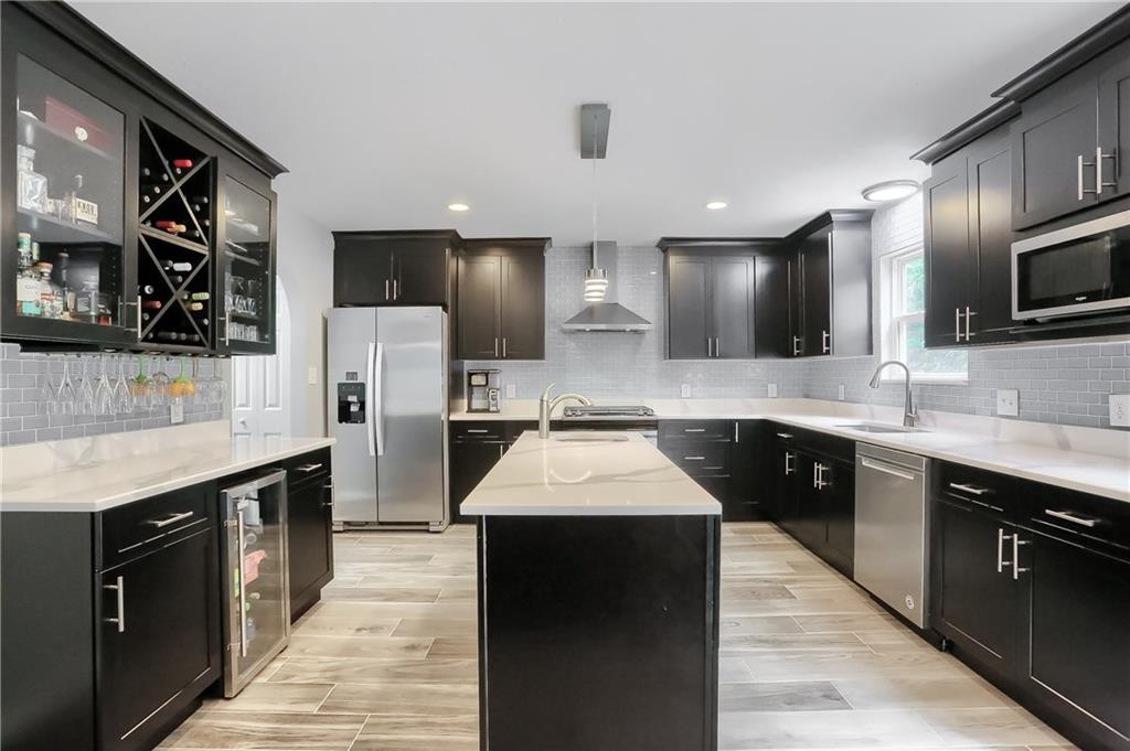 1075 Rural Ridge Drive Cheswick, PA 15024 - Photo 3 of 25 At the heart of the home is a gourmet kitchen with endless Quartz counterspace and generous custom cabinetry.