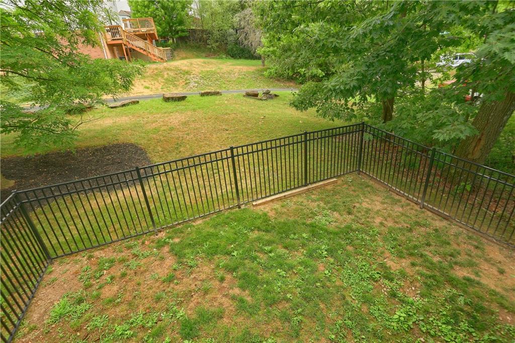 1075 Rural Ridge Drive Cheswick, PA 15024 - Photo 25 of 25 A fenced in rear yard provides space for a play set, a furry friend to run, a fire pit or anything else you may desire.