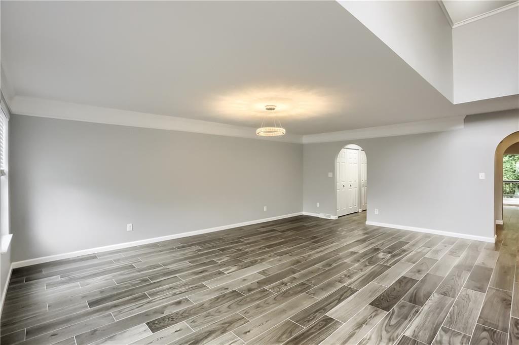 1075 Rural Ridge Drive Cheswick, PA 15024 - Photo 7 of 25 The enormous dining room boasts a modern tile floor and provides space for a large table and chairs.