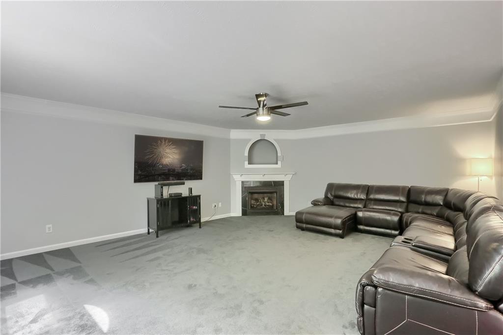 1075 Rural Ridge Drive Cheswick, PA 15024 - Photo 9 of 25 The kitchen opens to the family room featuring crown molding, neutral tones, new plush carpet and a fireplace for a chilly evening. .