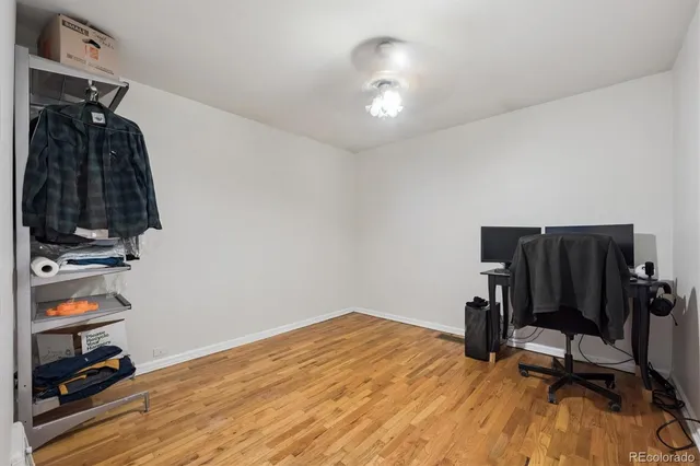 a view of a workspace with furniture and gym equipment