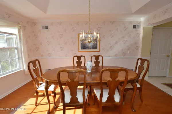 a view of a dining room with furniture window and outside view