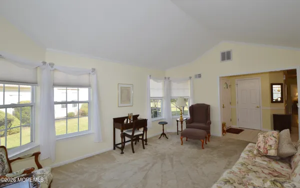 a dining room with furniture and window