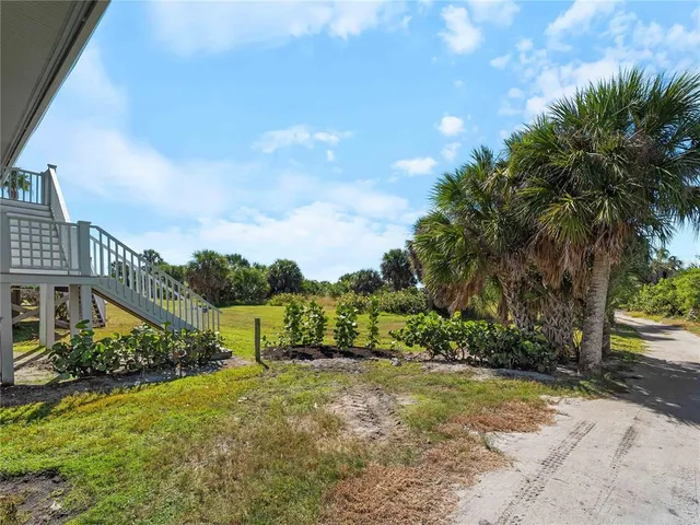 an aerial view of a house with pool fire pit and outdoor seating
