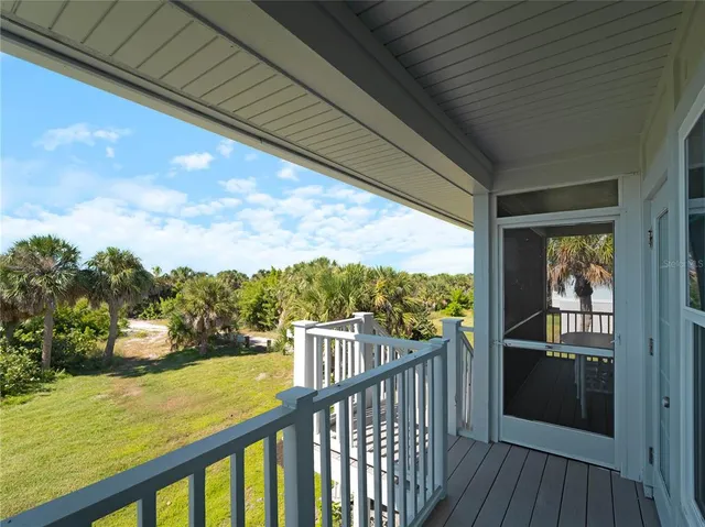 a view of balcony and wooden floor