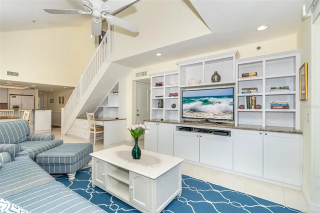 a bathroom with a sink a mirror a toilet and shower