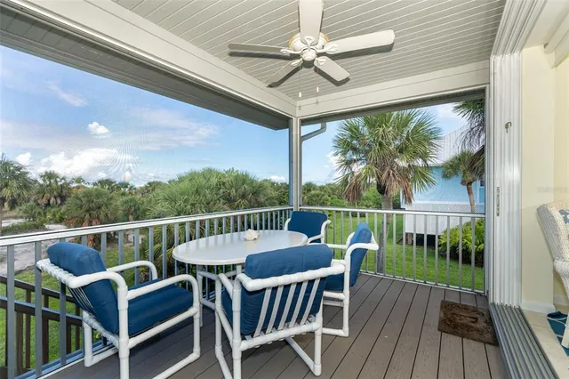 a roof deck with wooden floor and fence