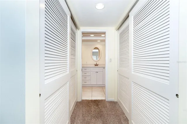 a view of a balcony with wooden floor and outdoor seating