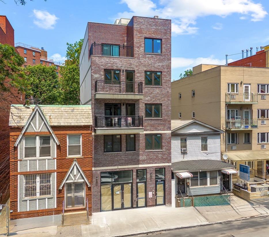 132-25 41st Avenue, Unit 5B Queens, NY 11355 - Photo 1 of 11 a view of a brick building next to a yard