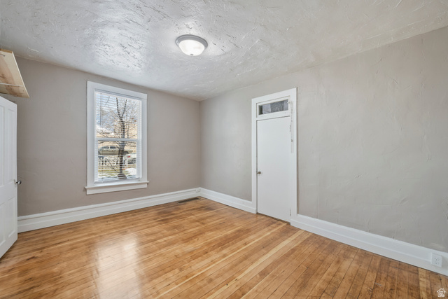 75 600 West Provo, UT 84601 - Photo 11 of 26 Hardwood flooring and light gray walls create a bright interior