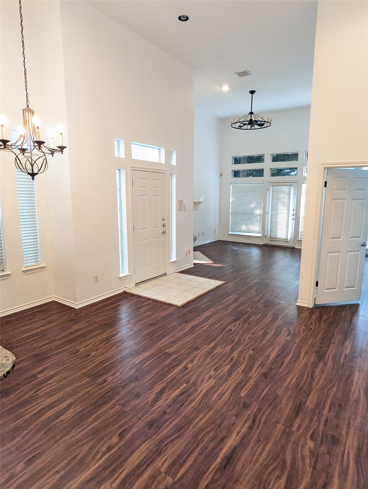 2918 Ranch Road 620 North, Unit Y194 Austin, TX 78734 - Photo 9 of 35 a view of empty room with wooden floor and kitchen